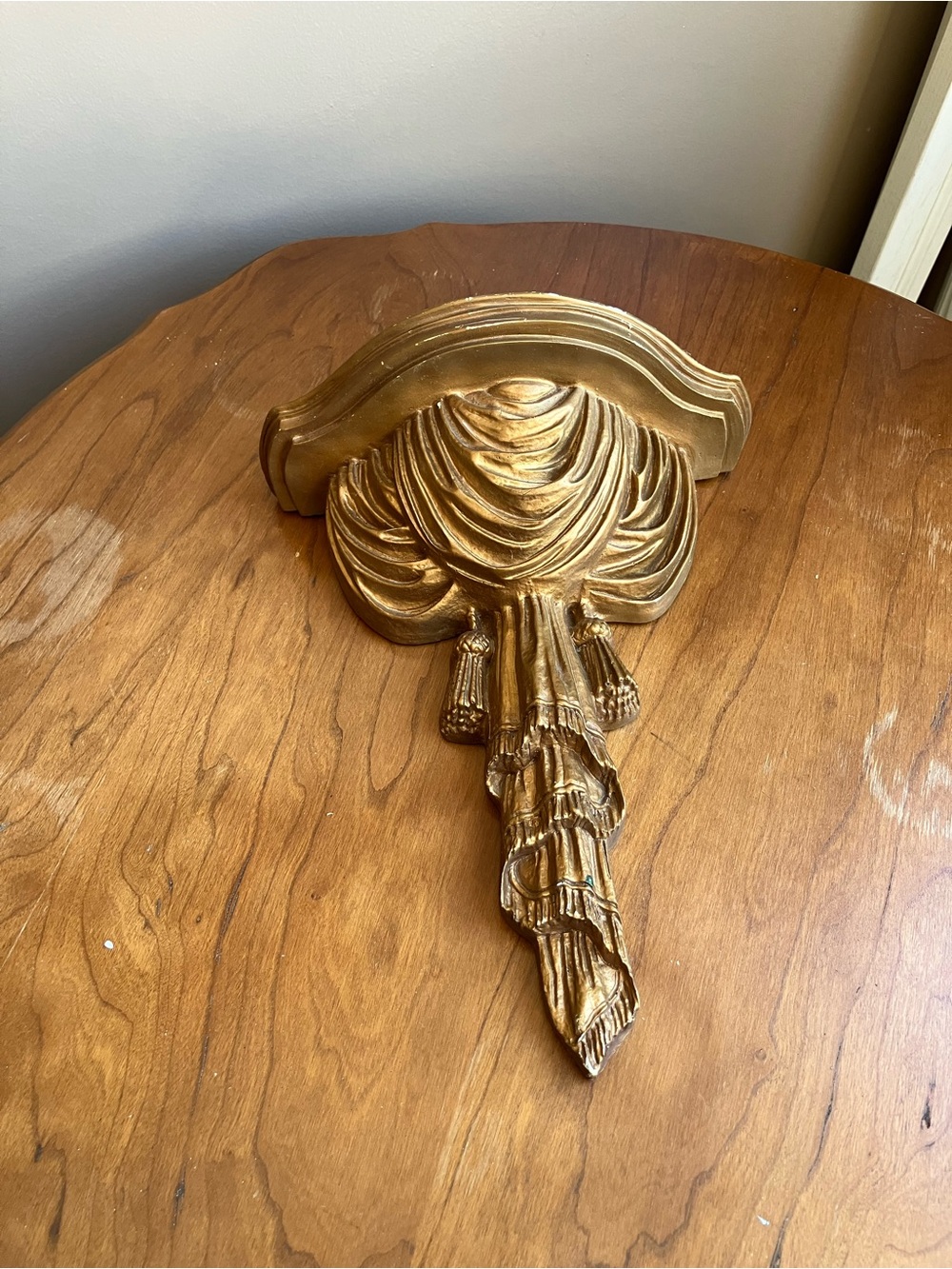Kirklands Gold Draped Wall Shelf Accent